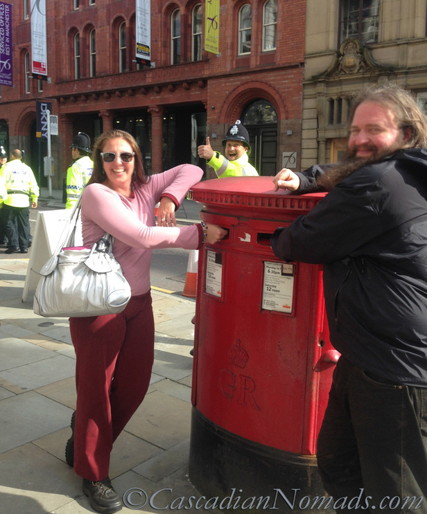 The Greatest Vacation Photo Ever Taken (near a mailbox without a dog.) A Manchester Bobby gives the Cascadian Nomads humans a thumbs up! Manchester, England, Uniuted Kingdom.